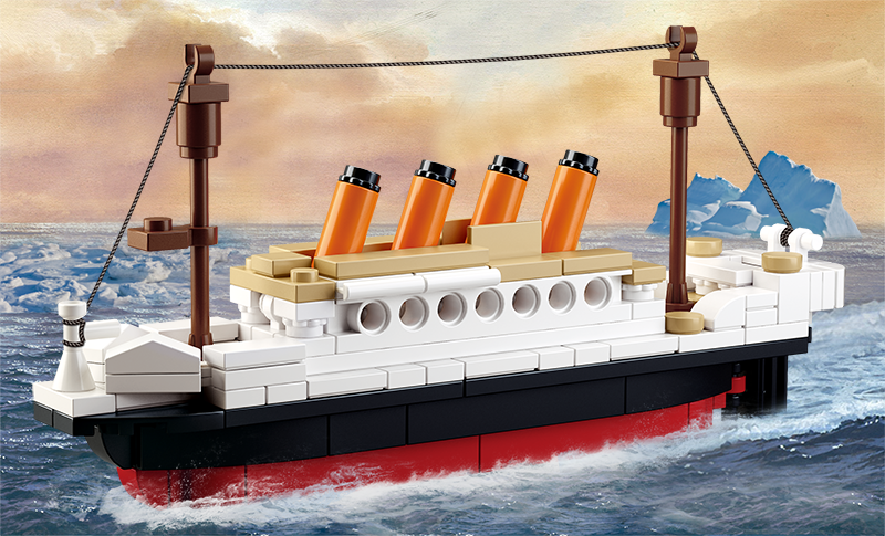 a box with a toy titanic ship and minifigures
