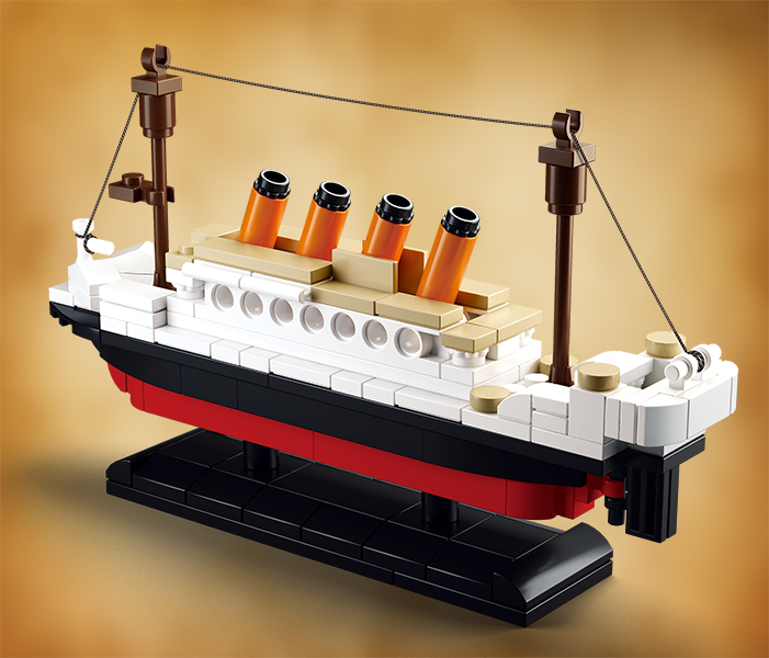 a box with a toy titanic ship and minifigures